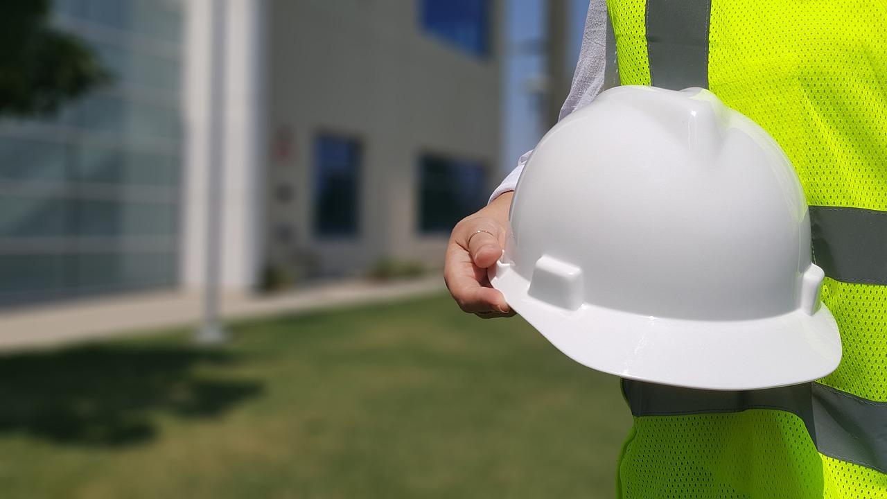 person holding a hard hat