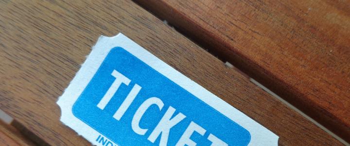Blue and white ticket on wooden table