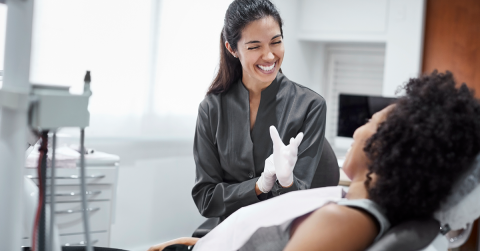 Dentist-smiling-at-patient