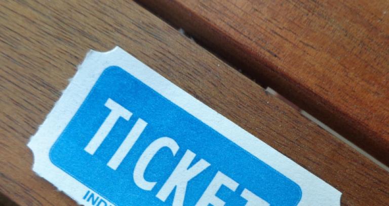 Blue and white ticket on wooden table
