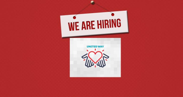sign saying "we are hiring" and the United Way symbol of hands holding a heart